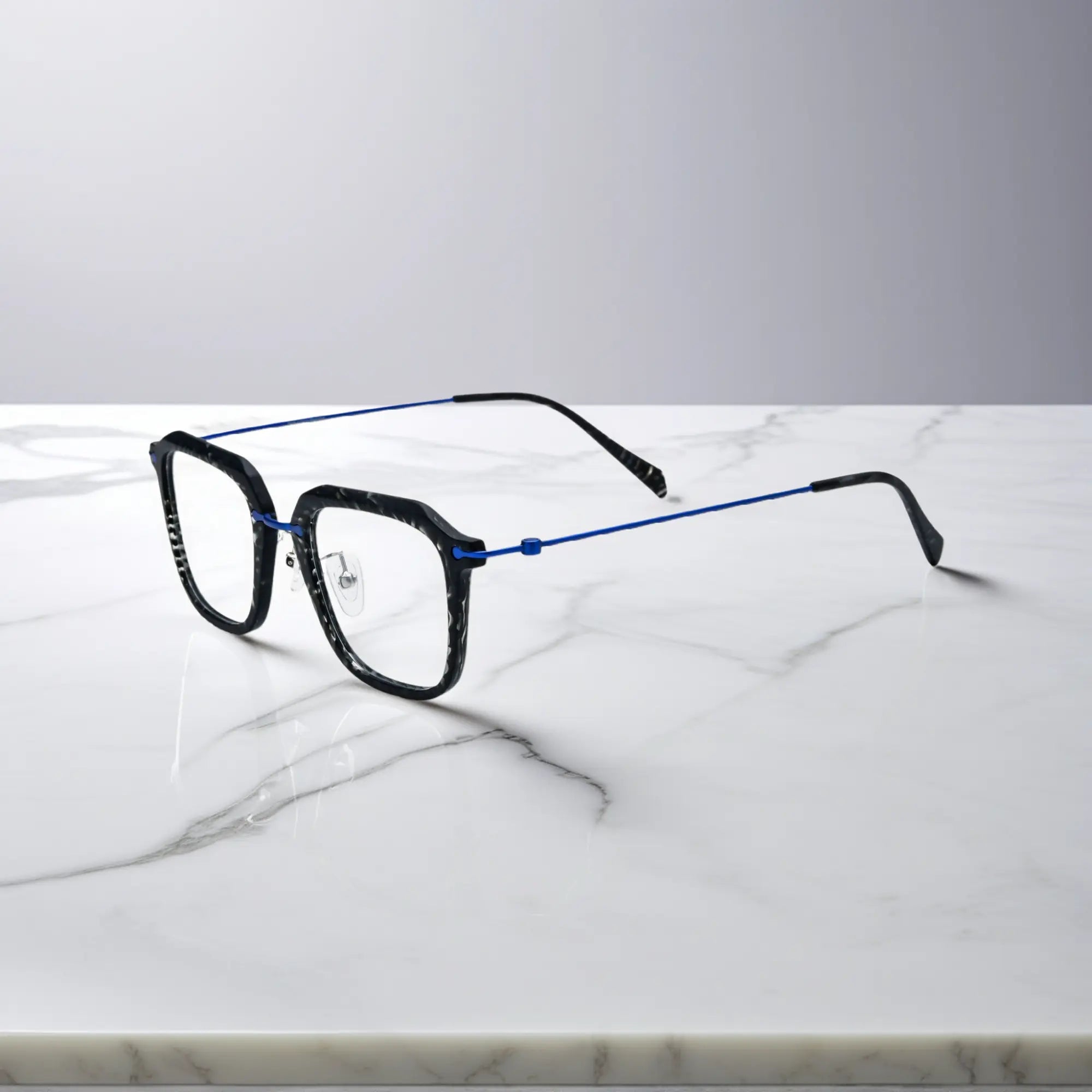 Sleek side view of the black frame with cool-toned titanium temple detailing.